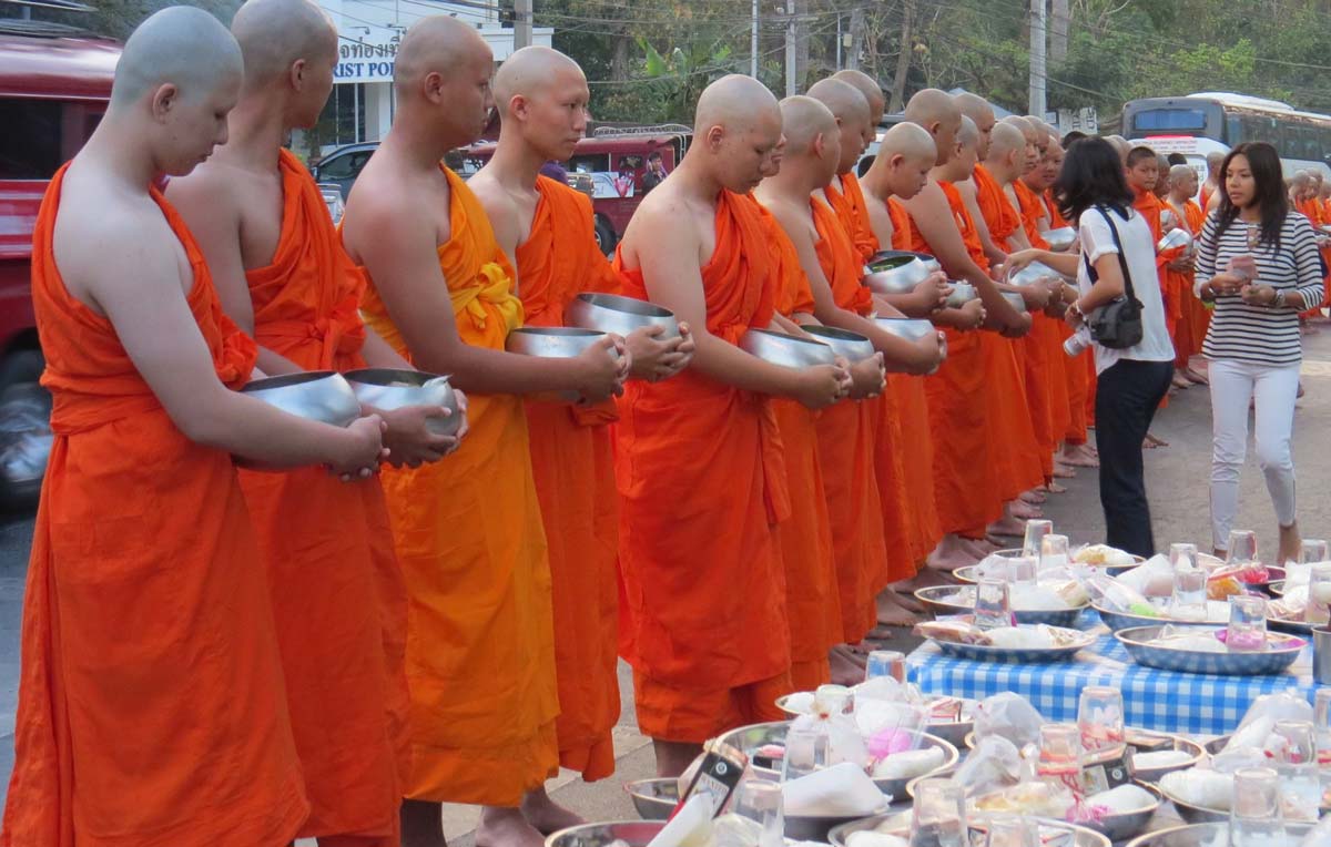 monks with bowls thailand