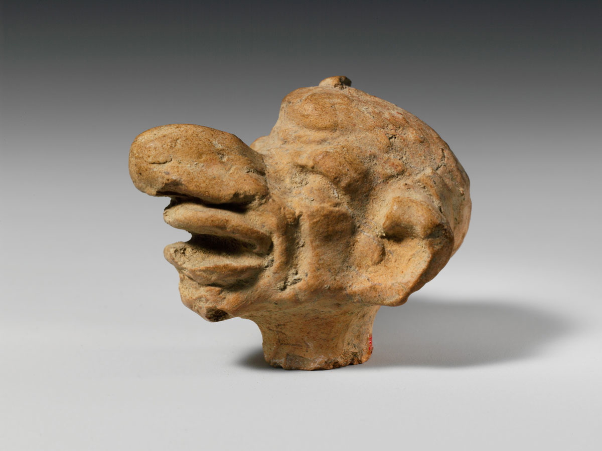 terracotta grotesque head greek 1st 2nd century bce