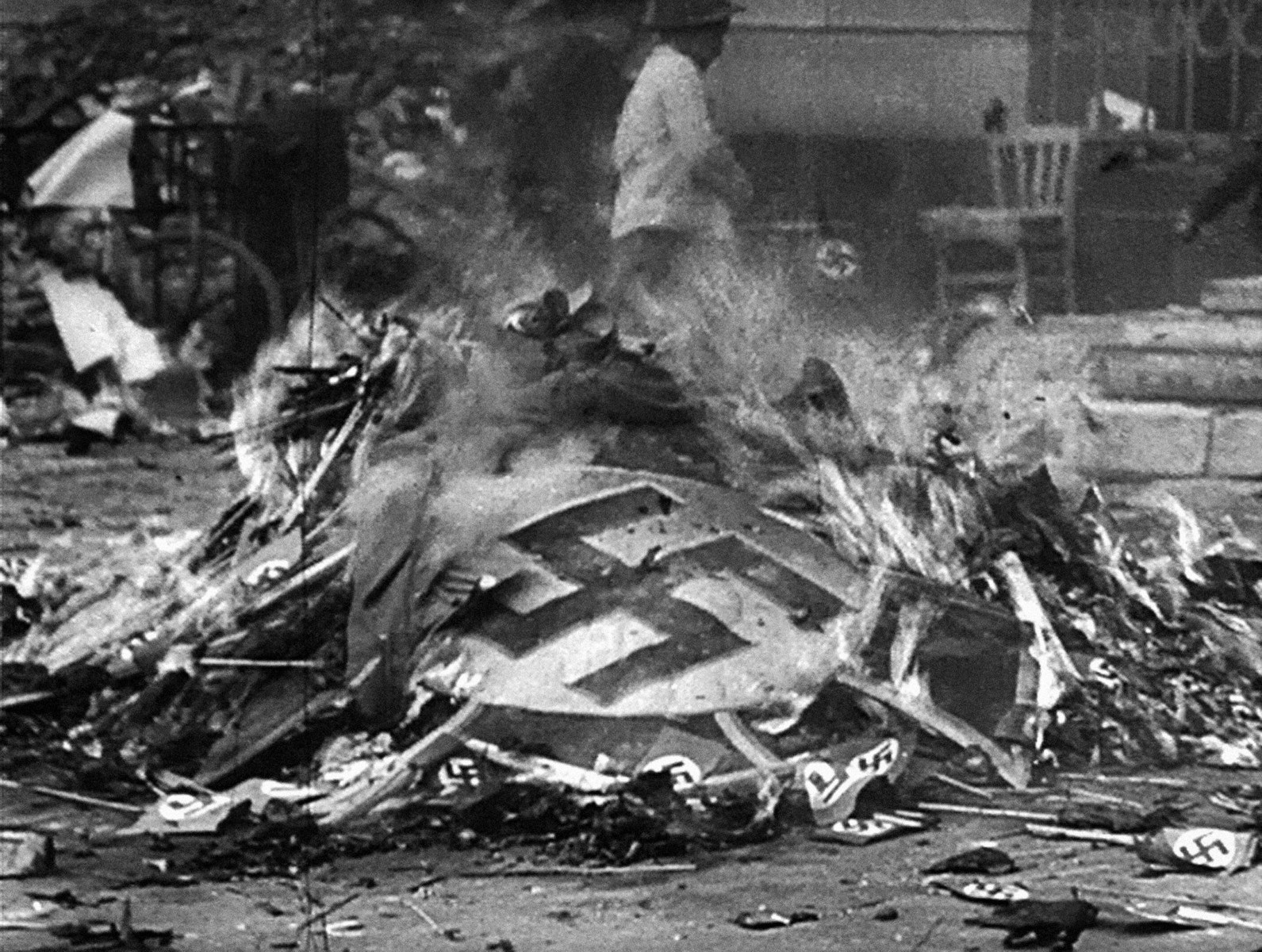 american soldiers burning nazi insignia photo