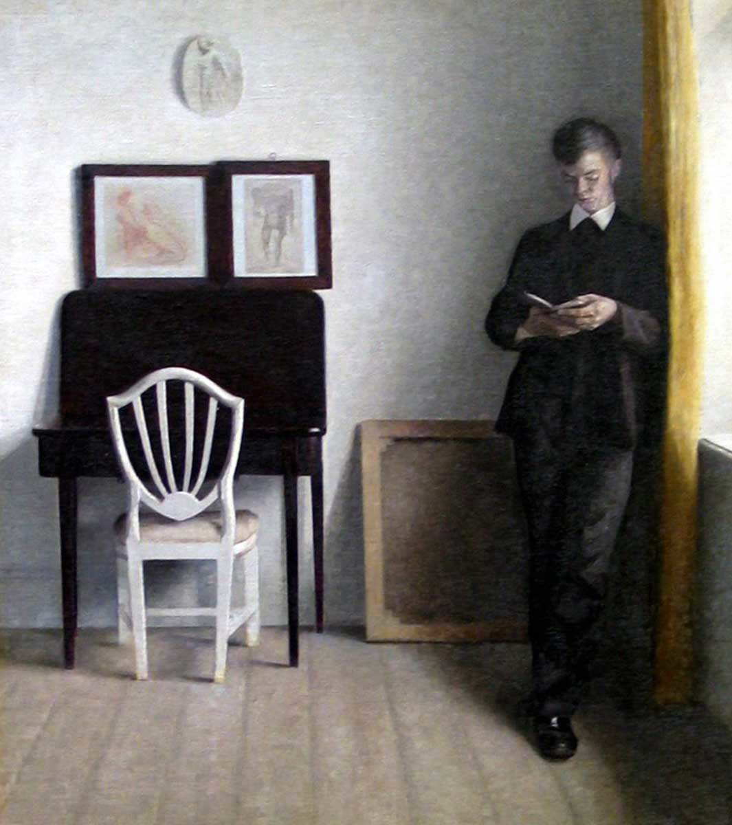 vilhelm hammershøi young man reading painting