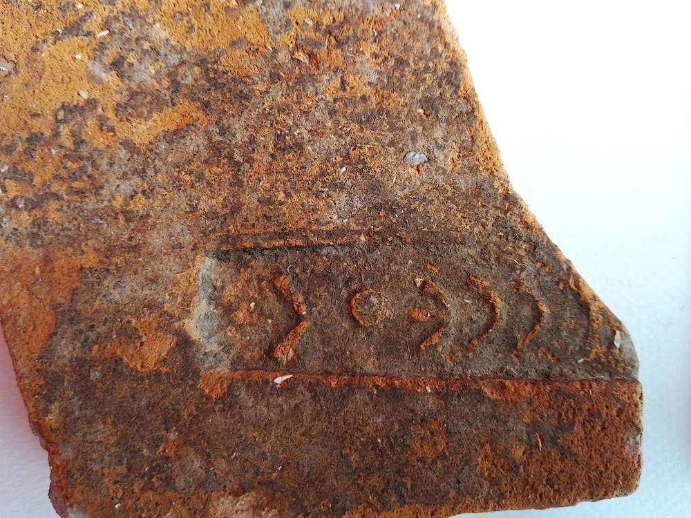 Tile fragment bearing name "Odysseus" found at the Sanctuary site in Ithaca.