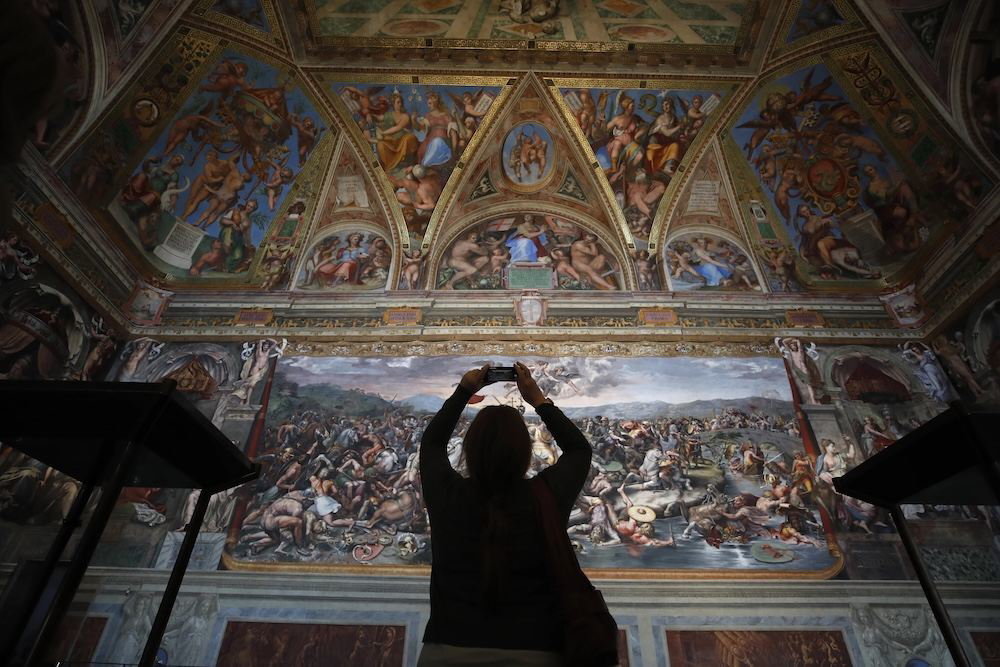Visitor at Raphael Rooms inside the Vatican Museums in Vatican City
