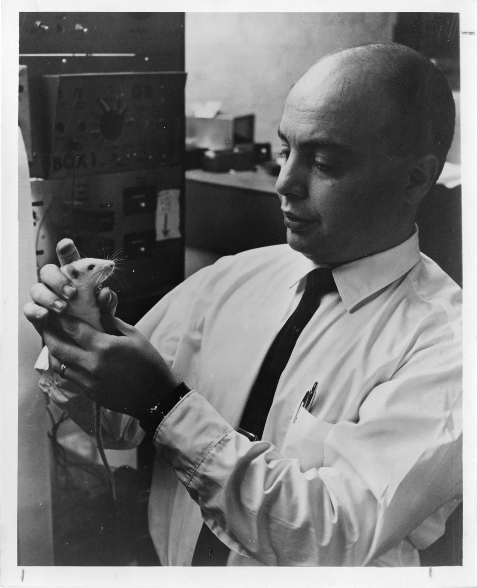 psychologist with a rat