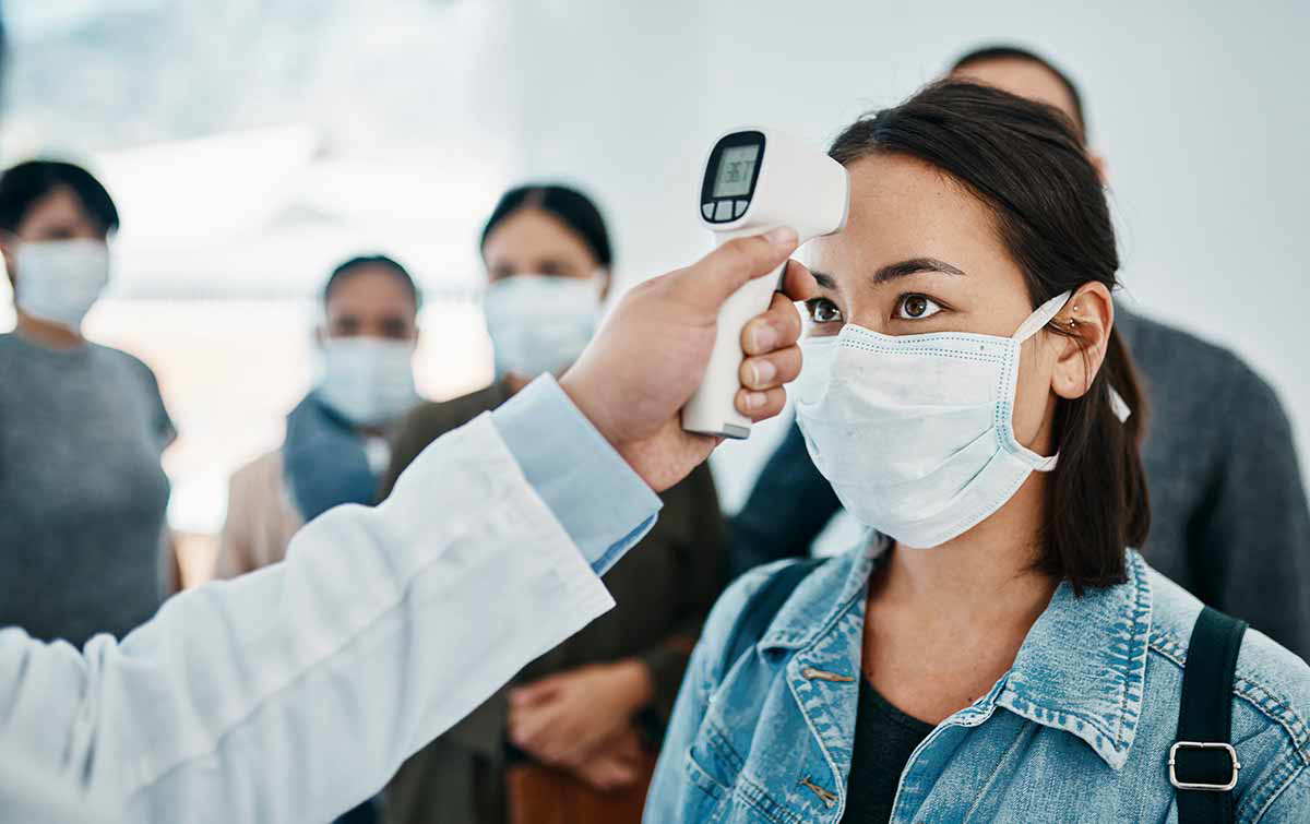 woman quarantine temperature check