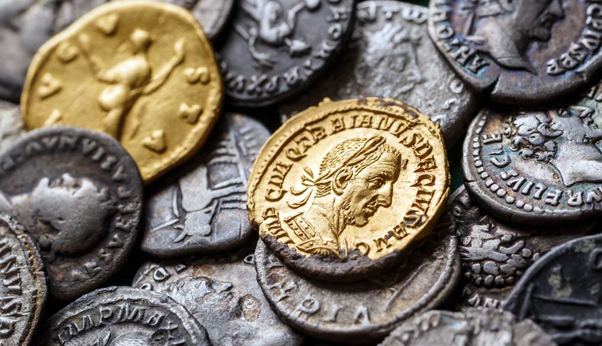 a collection of ancient Roman coins, featuring both gold and silver pieces
