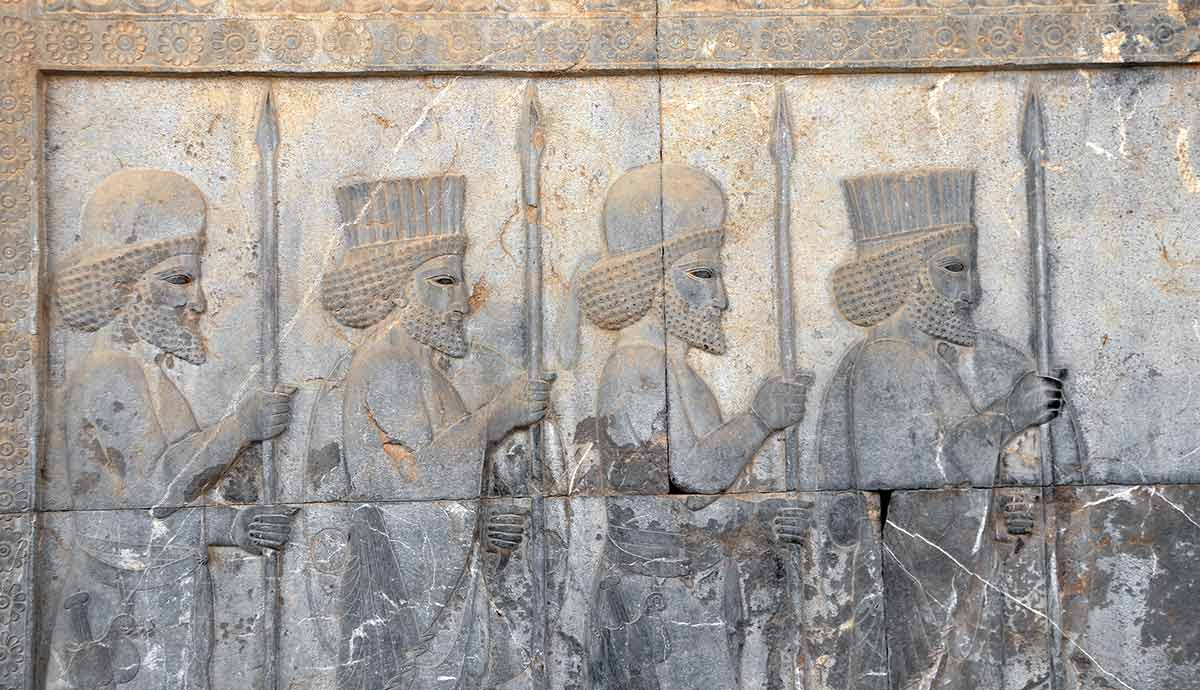 Ancient soldiers carved in stone relief