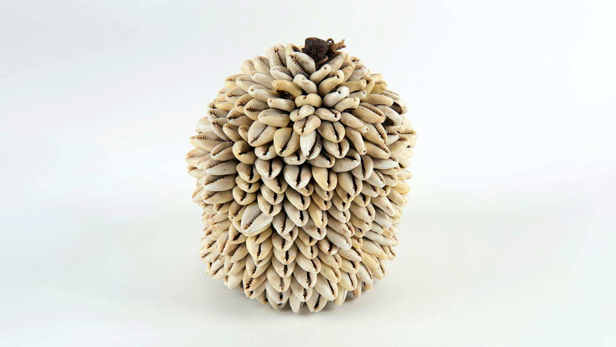 leather container cowrie shells