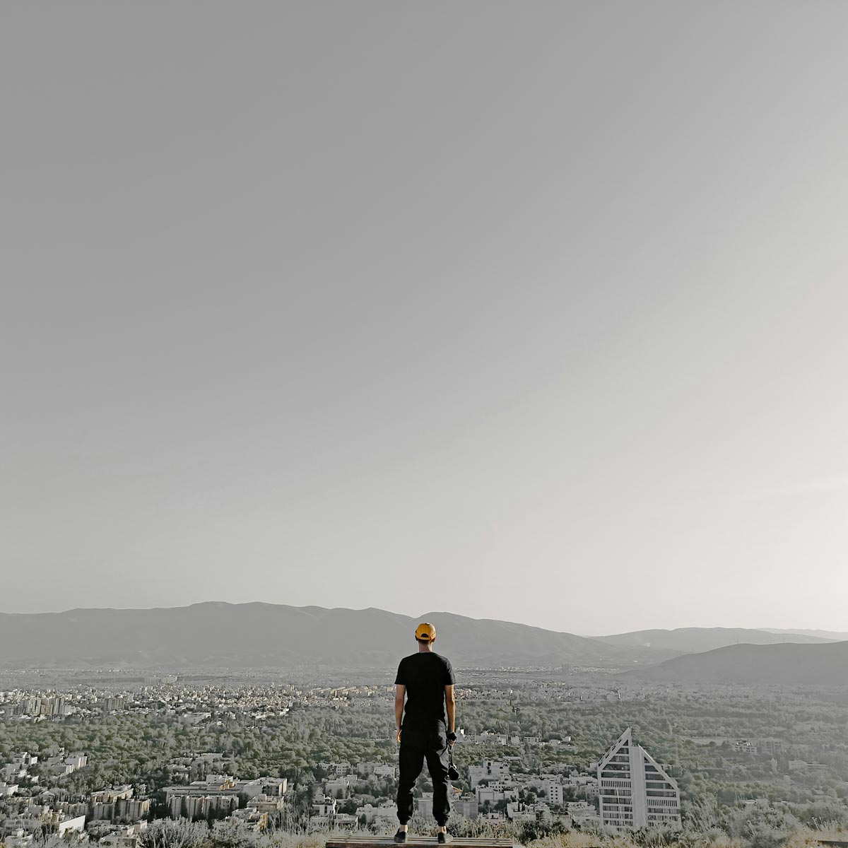 man looks at shiraz city
