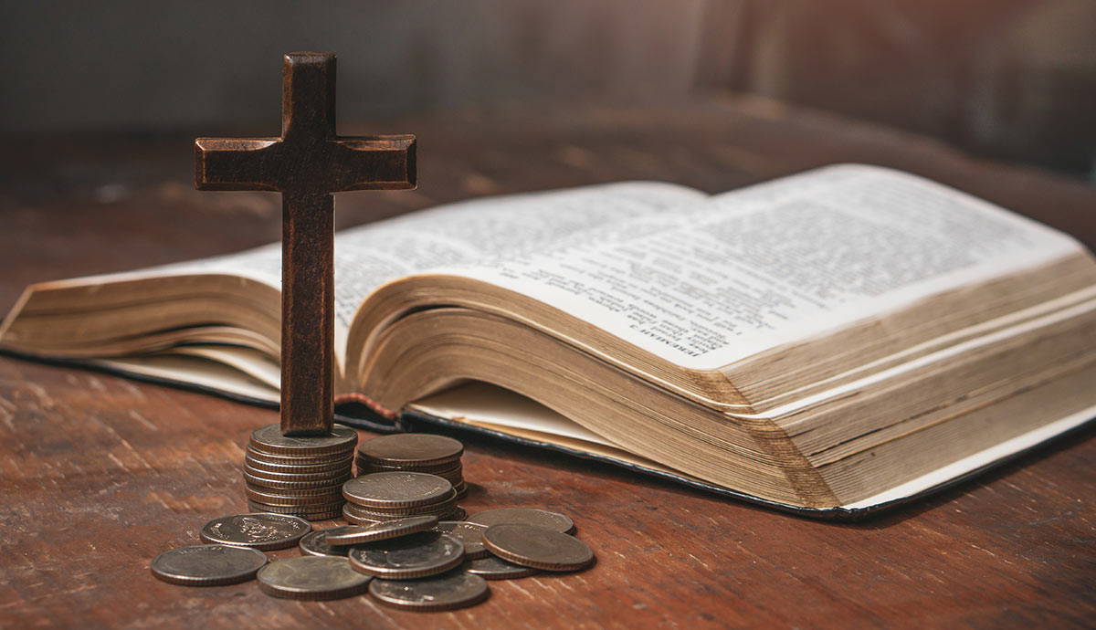 Christian cross, Bible, and coins