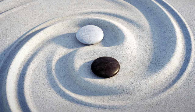 Zen garden Yin-Yang symbol with stones and sand