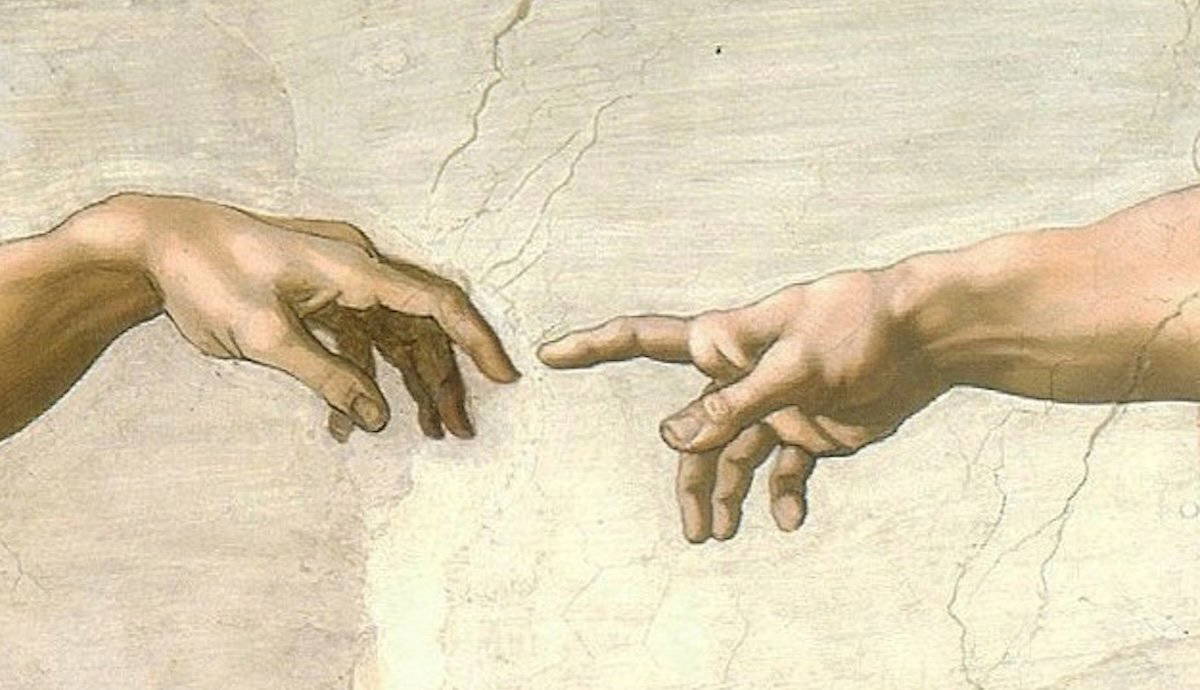 detail of Michelangelo's painting of God and Adam