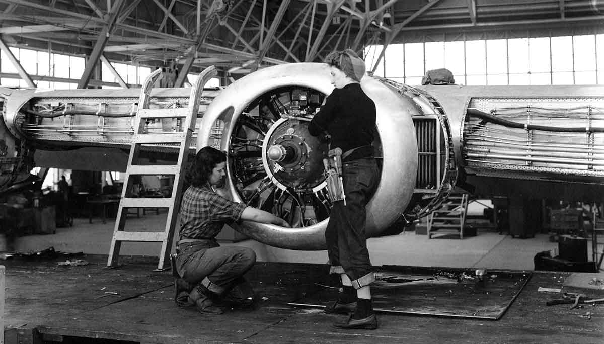 women working on airplane