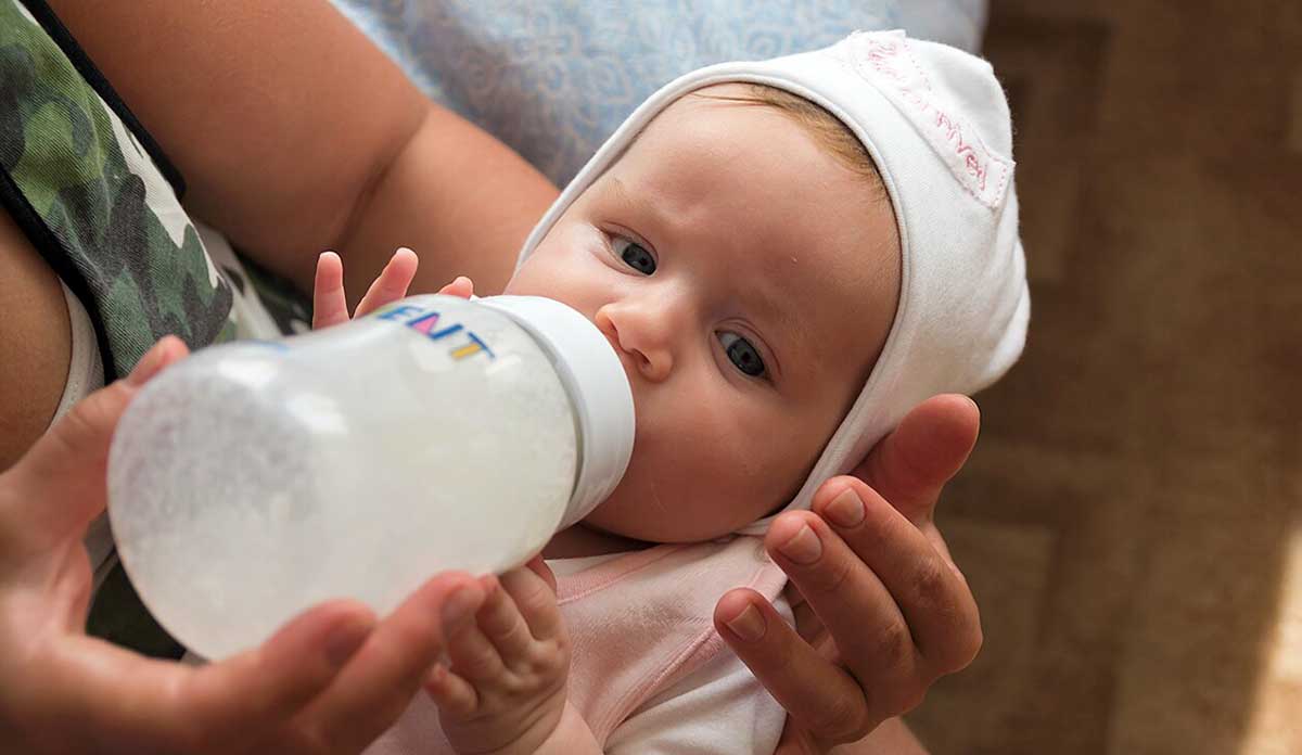 baby drinking milk from bottle