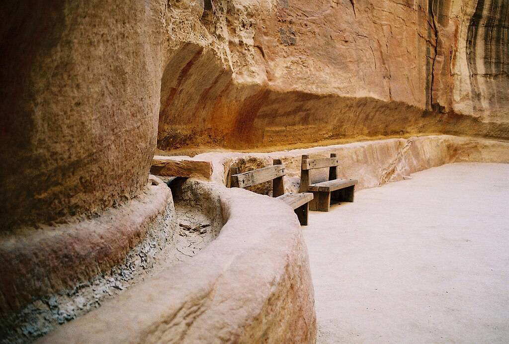 Horizontal view of a rock-cut water channel in Petra’s Siq, showing carved trough and cover stones, Nabataean hydrology, 1st century BCE–1st century CE.