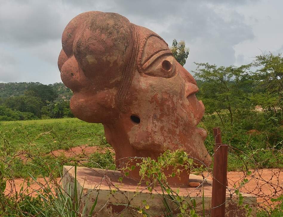 Wide shot of a Nok terracotta figure in situ at Nok village, Kaduna State, Nigeria, associated with c. 1500 BCE–300 CE.