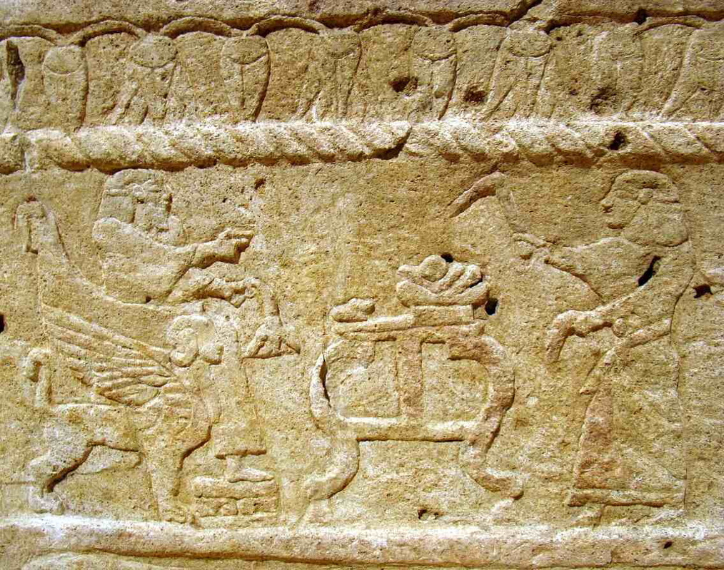 Horizontal color photo of the Ahiram sarcophagus with Phoenician inscription and relief carving, Byblos, c. 1000–900 BCE, Beirut National Museum.
