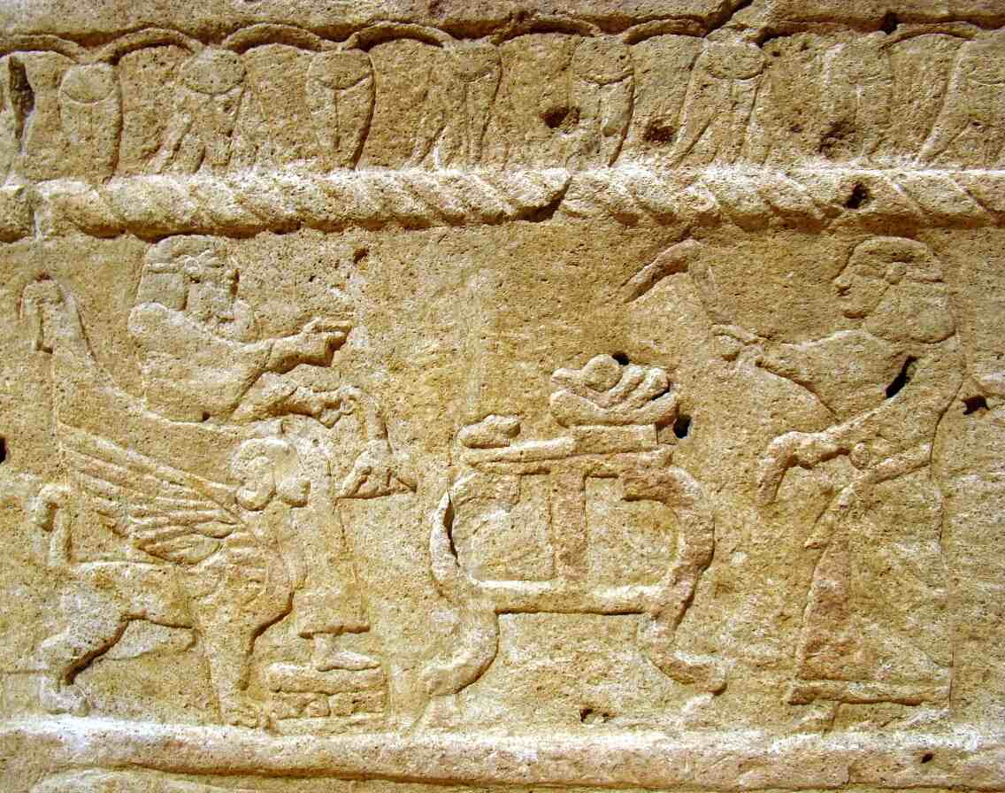 Horizontal color photo of the Ahiram sarcophagus with Phoenician inscription and relief carving, Byblos, c. 1000–900 BCE, Beirut National Museum.