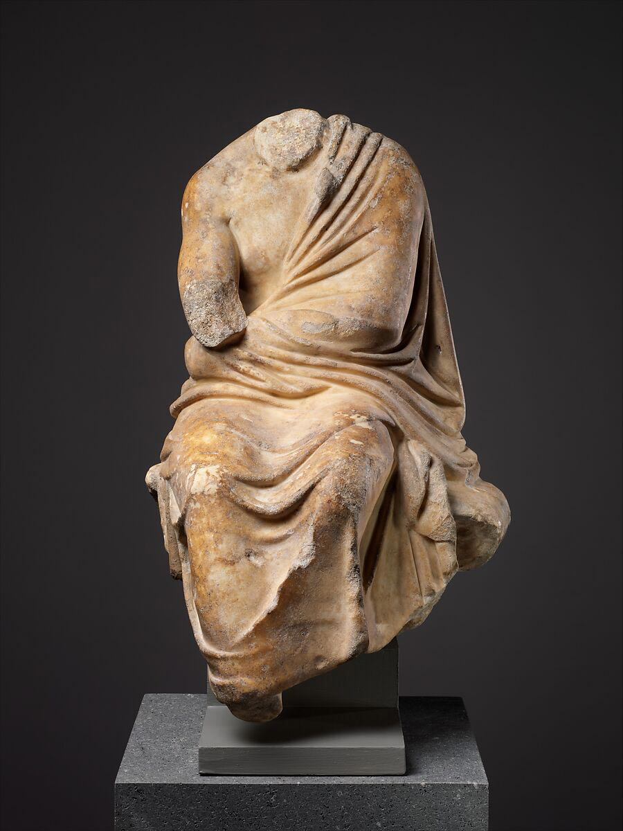 statuette of seated philosopher