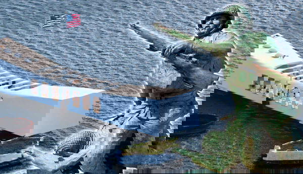 USS Arizona Memorial and soldier statue