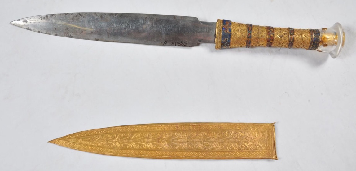 ChatGPT said:Close-up of Tutankhamun’s meteoritic iron dagger with gold hilt and sheath on display.