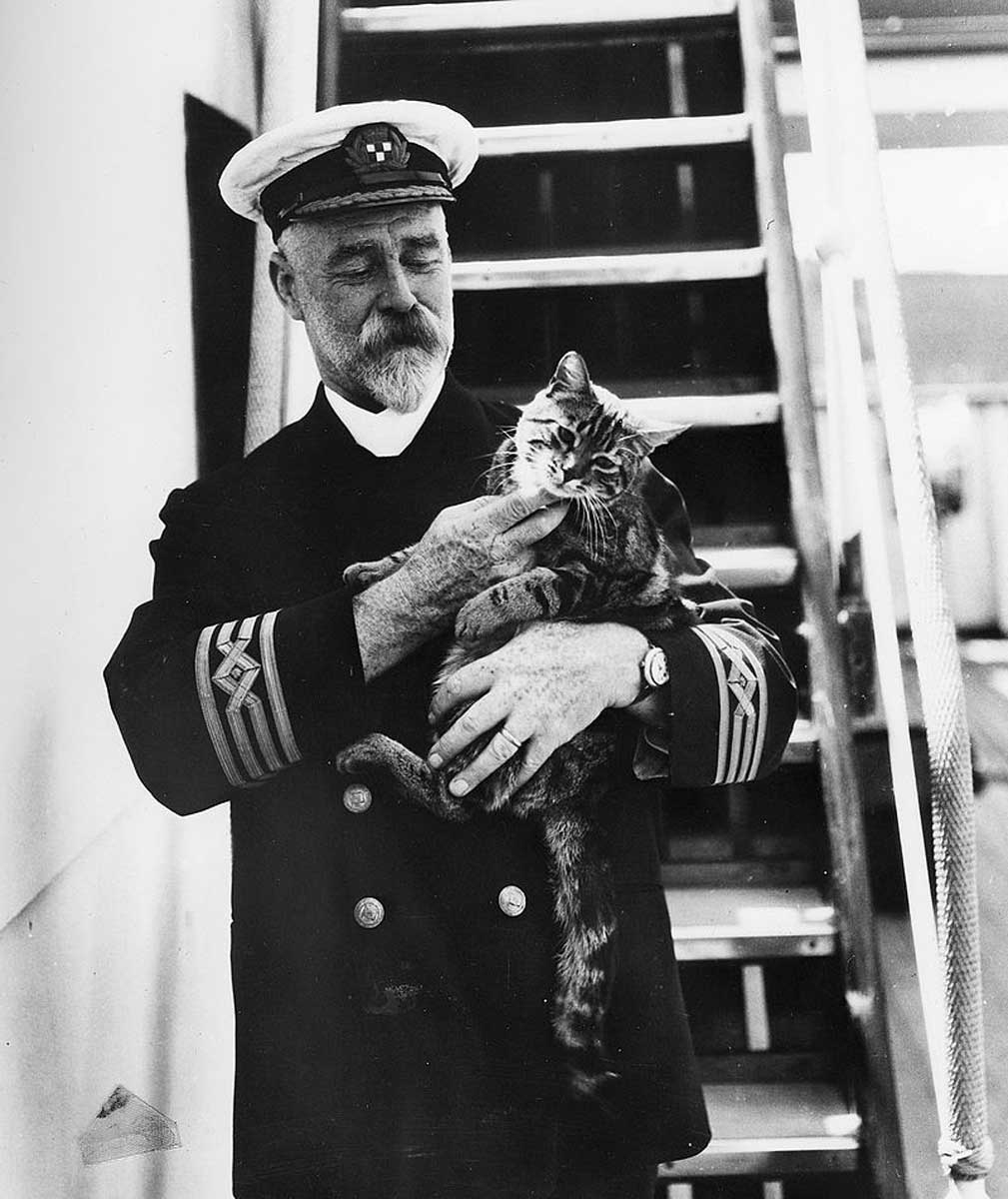 captain with cat nautical superstitions