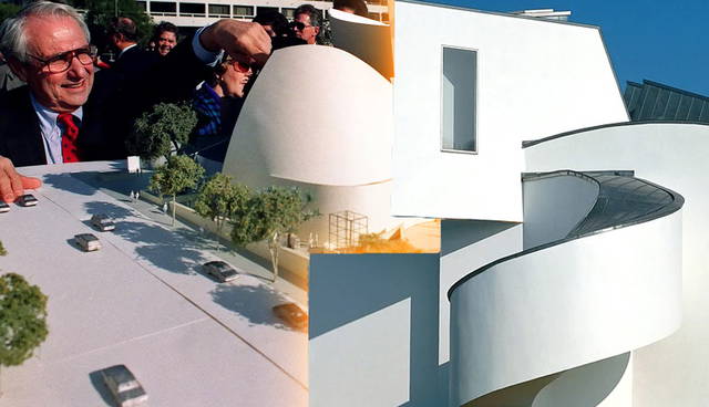 Frank Gehry looks over a model of his Walt Disney Concert Hall