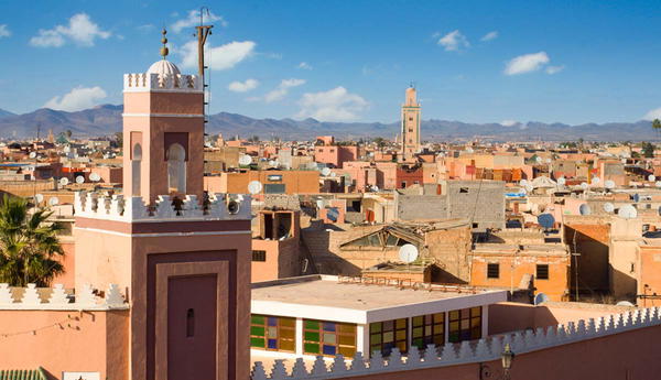 Rooftop view of Marrakech with mosque minarets and cityscape