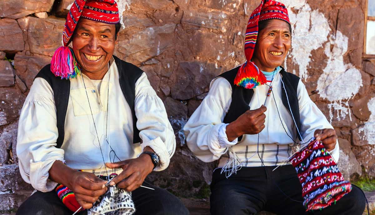 men knitting taquile island