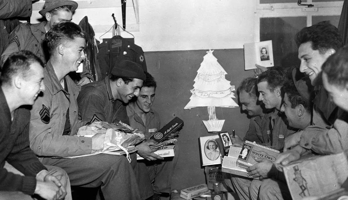 soldiers opening wwii christmas packages