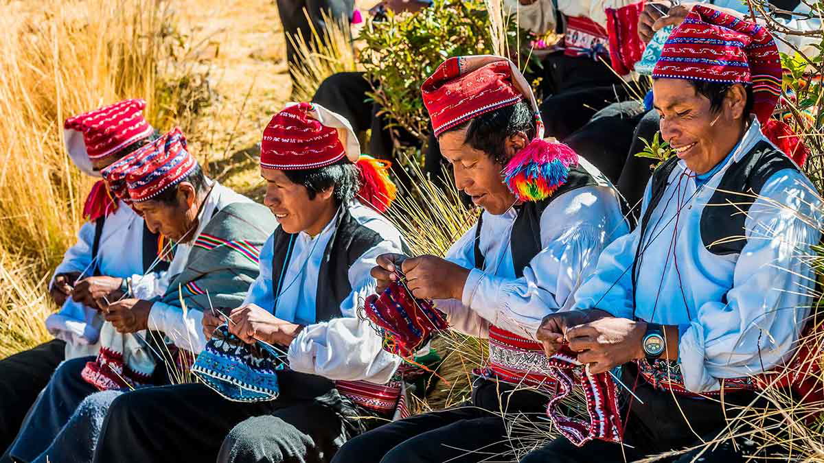 taquile island men knitting