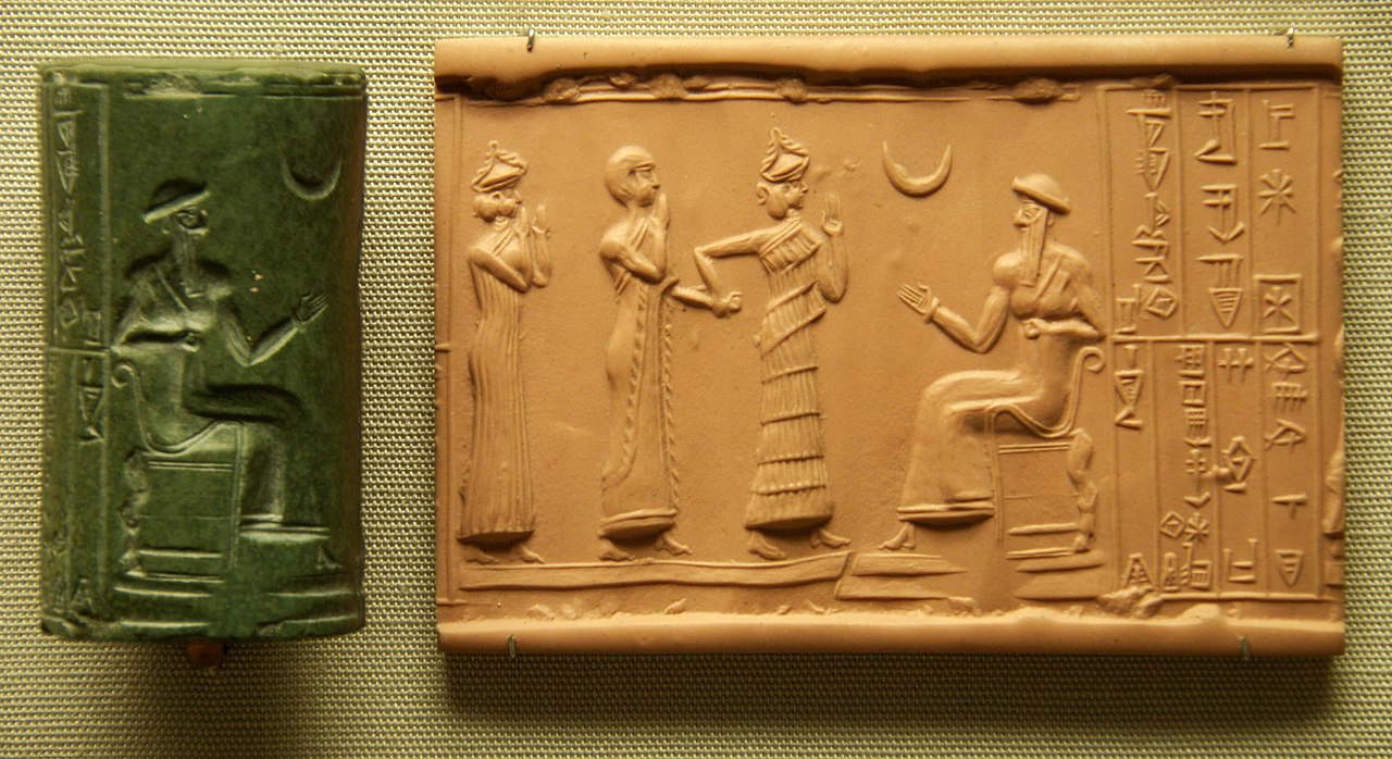 The Sumerian King Ur-Nammu (seated), the creator of the Code of Ur-Nammu, bestows governorship on Ḫašḫamer, ensi of Iškun-Sin, cylinder seal, c. 2100 BCE. Source: British Museum