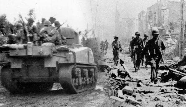 World War II soldiers and tank advancing