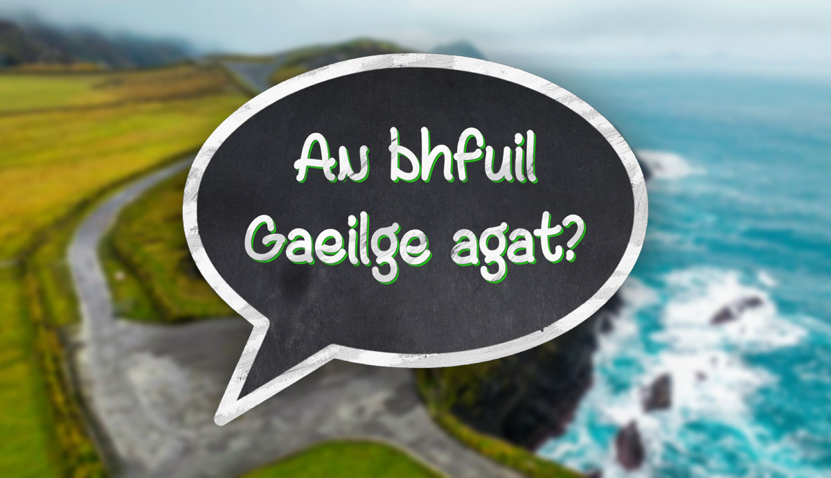 Irish coastal road with Gaelic speech bubble