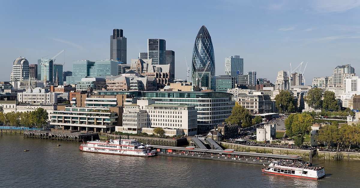 View of London’s skyline from London City Hall showing skyscrapers and the River Thames under a clear sky.