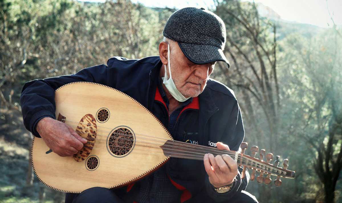 man playing oud