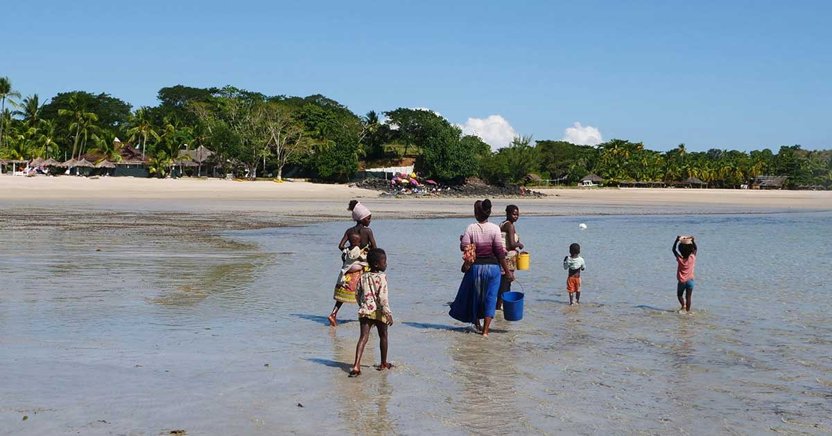 nosy be people walking beach settler colonialism