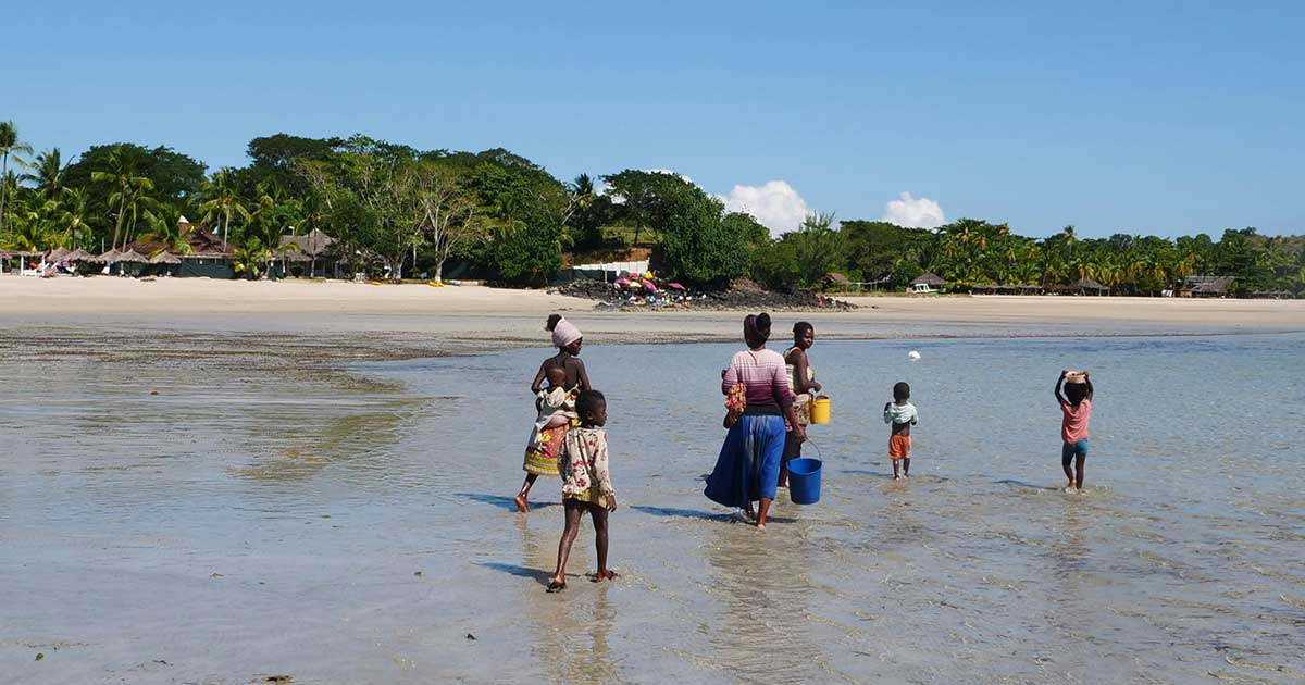 nosy be people walking beach settler colonialism