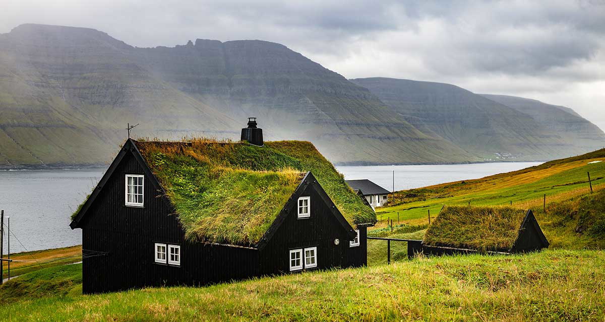 turf roof houses faroe islands viking trail