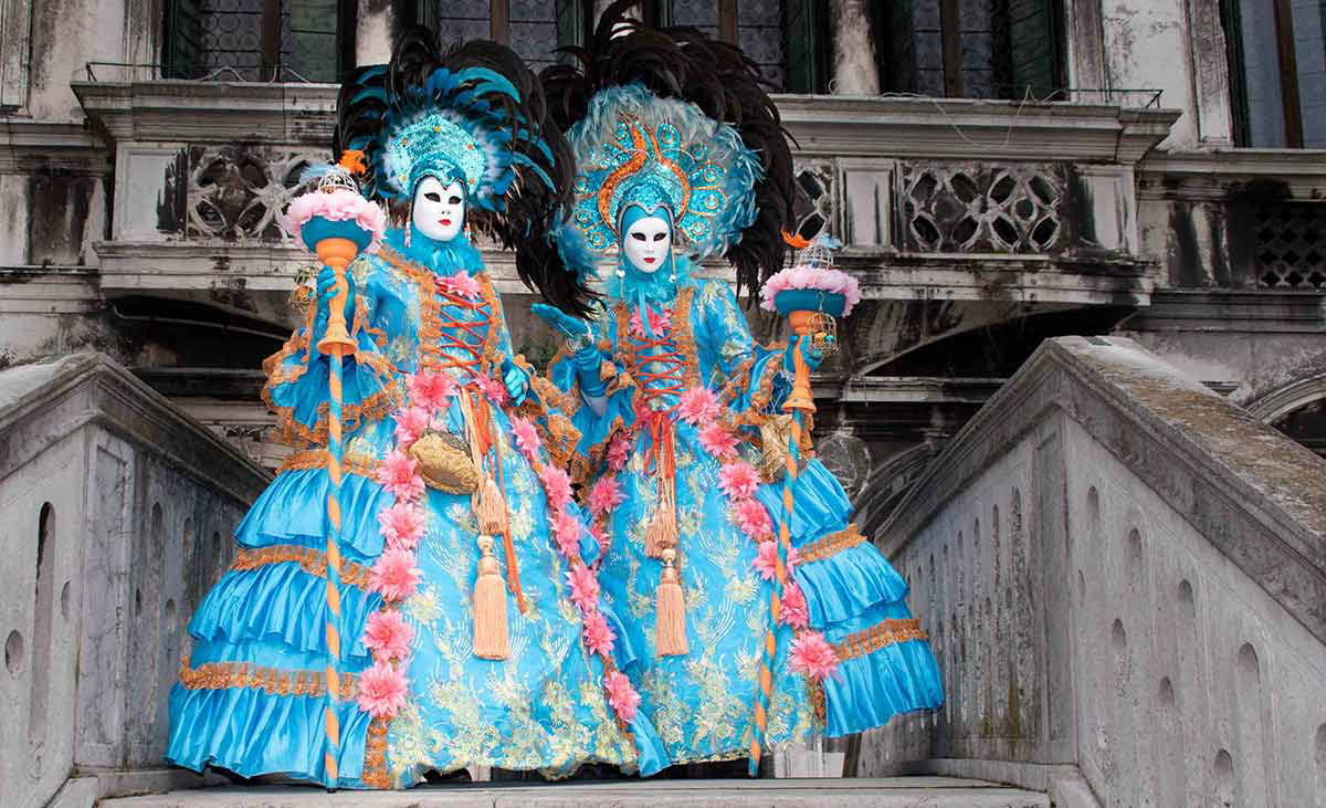 two attendees blue costumes venetian carnival