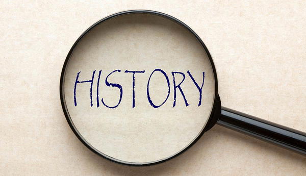 Magnifying glass over the word history