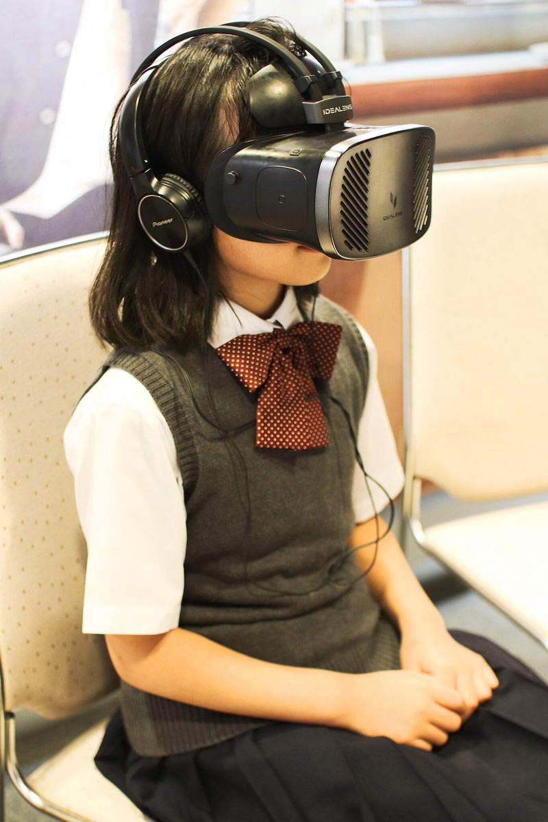 girl wears vr headset