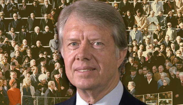 Jimmy Carter and a large crowd of spectators.