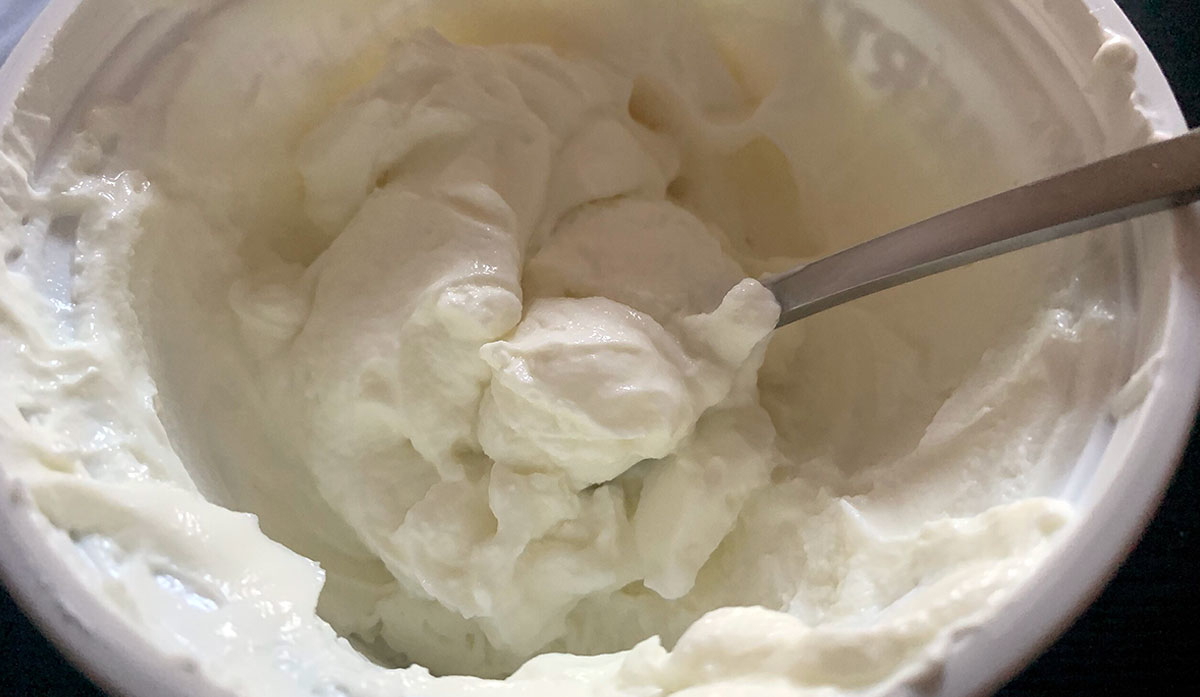 skyr in a cup with spoon