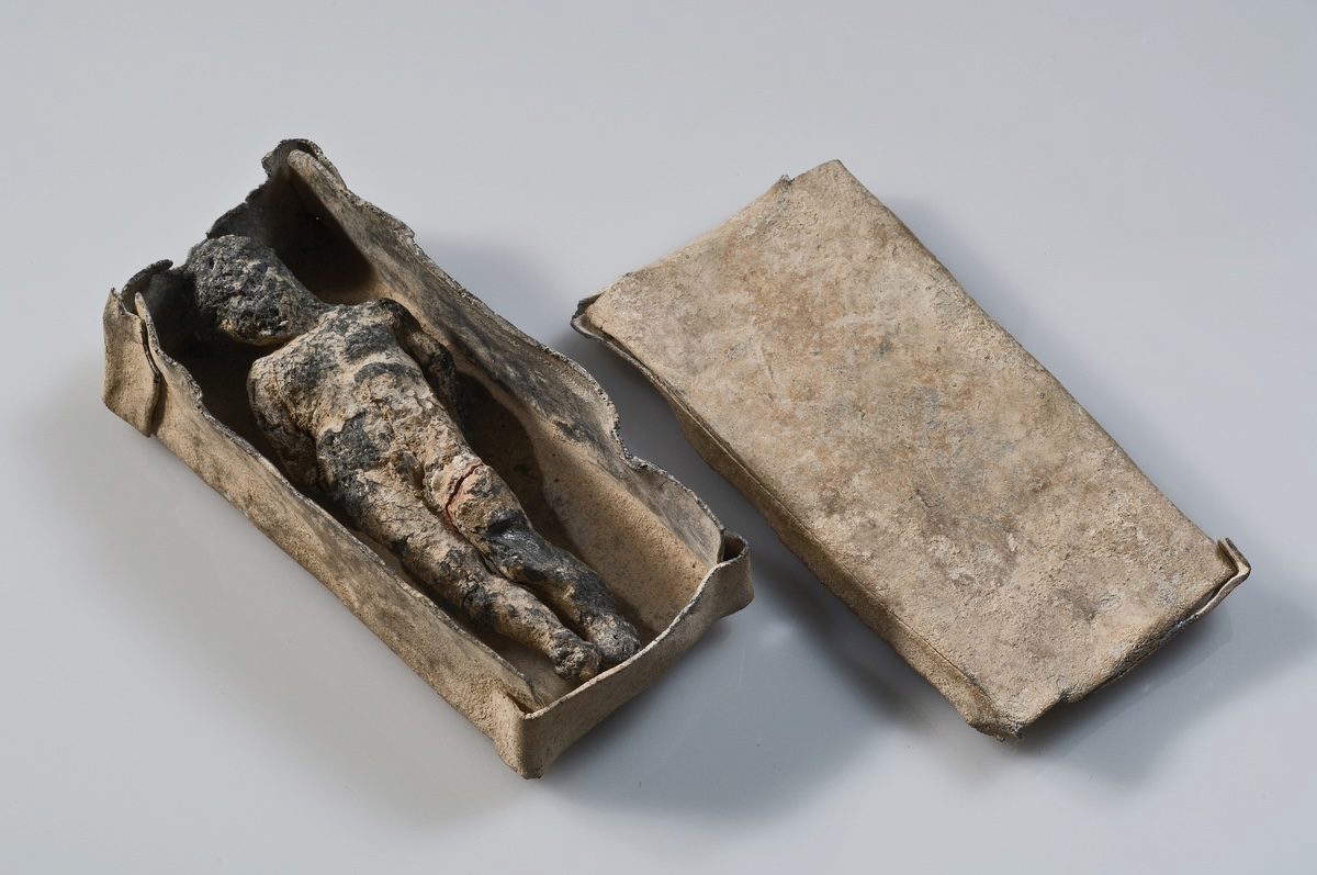 Miniature coffin with curse figure. Greek, 4th century BC