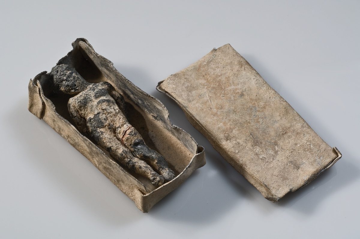 Miniature coffin with curse figure. Greek, 4th century BC