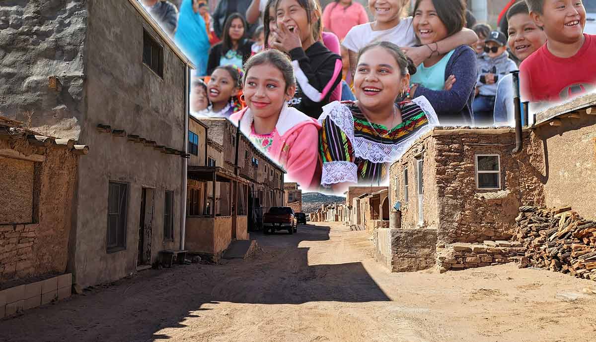 Pueblo village and smiling community members