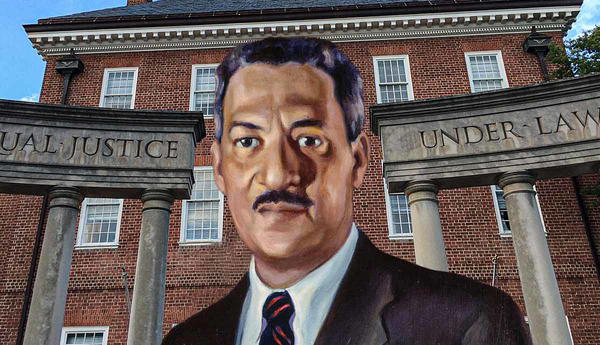 Thurgood Marshall portrait in front of courthouse