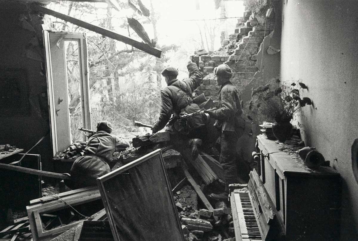 soldiers piano destroyed house