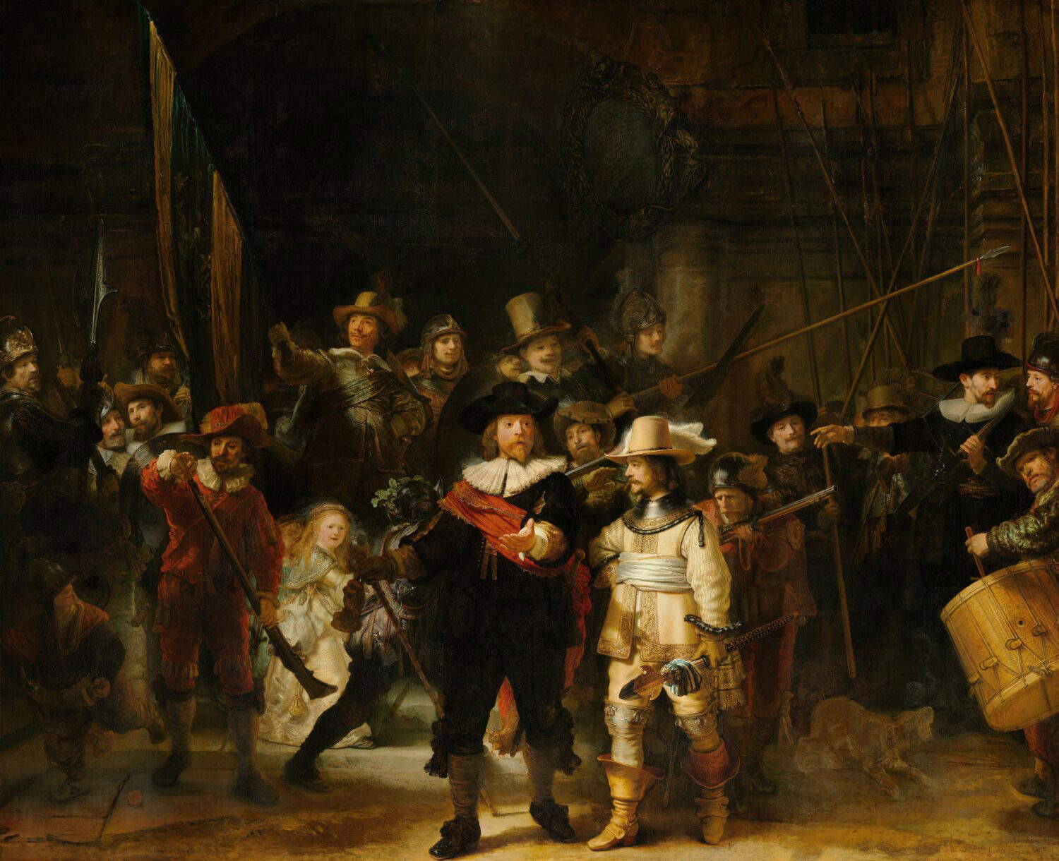 A monumental Baroque oil painting featuring a large group of Dutch civic guardsmen emerging from a dark, shadowed archway into a burst of dramatic light. At the center, Captain Frans Banninck Cocq, dressed in black with a red sash, gestures forward while speaking to Lieutenant Willem van Ruytenburch, who wears ornate yellow-gold attire. To the left, a young girl in a glowing gold dress, with a dead chicken hanging from her belt, acts as a symbolic mascot. The scene is filled with kinetic energy, featuring men holding pikes, muskets, and a large unfurled flag against a backdrop of complex architectural shadows.