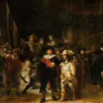 A monumental Baroque oil painting featuring a large group of Dutch civic guardsmen emerging from a dark, shadowed archway into a burst of dramatic light. At the center, Captain Frans Banninck Cocq, dressed in black with a red sash, gestures forward while speaking to Lieutenant Willem van Ruytenburch, who wears ornate yellow-gold attire. To the left, a young girl in a glowing gold dress, with a dead chicken hanging from her belt, acts as a symbolic mascot. The scene is filled with kinetic energy, featuring men holding pikes, muskets, and a large unfurled flag against a backdrop of complex architectural shadows.